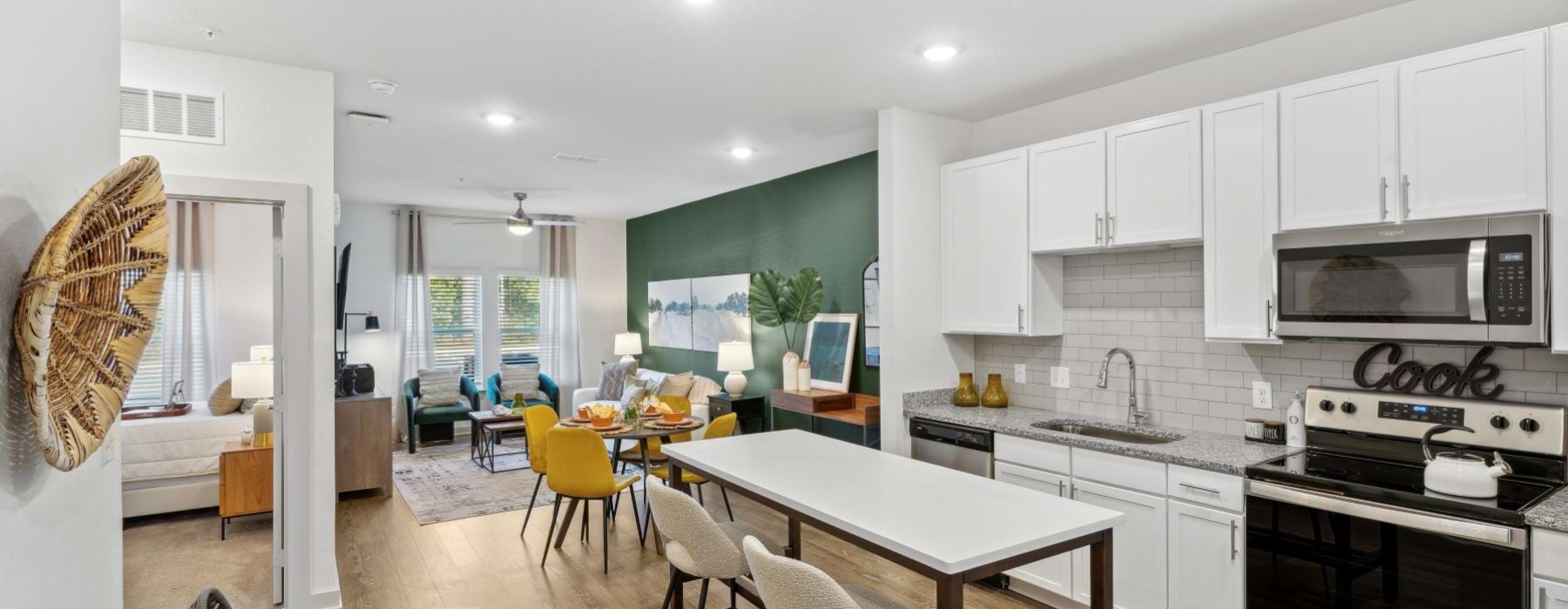a kitchen with white cabinets