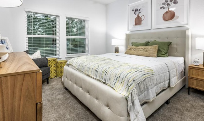 Beautiful bedrooms to fit every need a bedroom with a bed and a chair